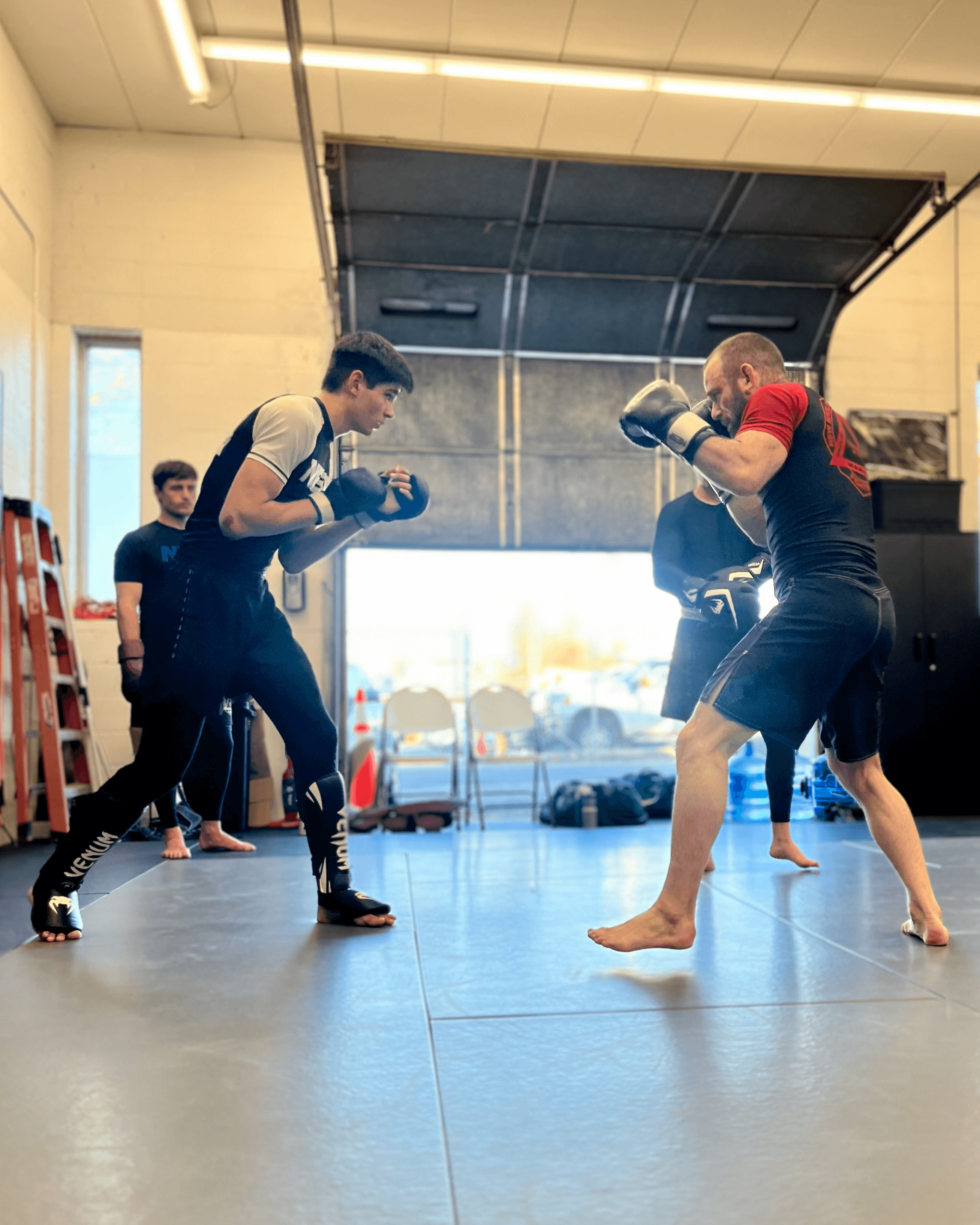 Head instructor sparring with student.