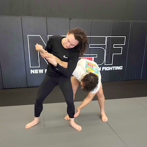 Female student perfomring self-defense technique.