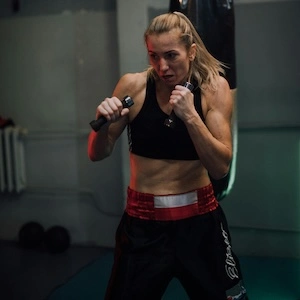 Photo of a woman kickboxing.